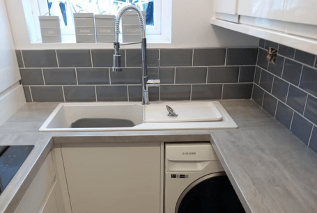 Sink view of renovated kitchen in Welling